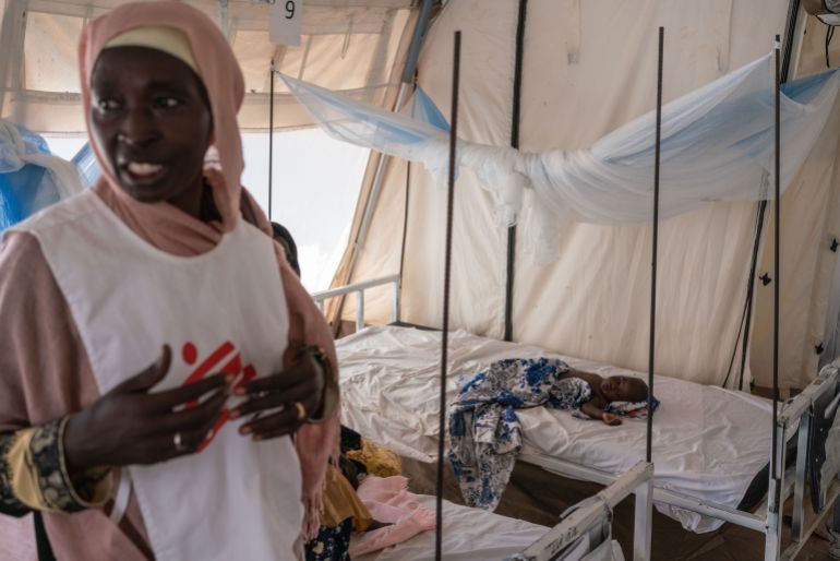 ADRE, CHAD - SEPTEMBER 19: Huda Abdulha, a health promotion worker, talks with patients in the Doctors Without Borders clinic inside the Adre camp, where around 200,000 people are currently taking refuge on September 19, 2023 in Adre, Chad. The conflict in Sudan, entering its sixth month, has left thousands of civilians dead and displaced more than five million people. More than 420,000 people have already found refuge in neighbouring Chad as hundreds continue to arrive daily. (Photo by Abdulmonam Eassa/Getty Images)