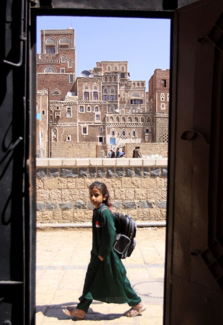 An unidentified Yemeni school girl is seen through the Saba Institute gate in the capital San'a, Yemen Sunday. Oct. 31, 2010. Al Qaida in Yemen, suspected in the thwarted mail bombing attempt, appears to be aggressively seeking to recruit American and European radicals who could provide an entry way for the group to carry out attacks in their homelands. (AP Photo/Hasan Jamali)