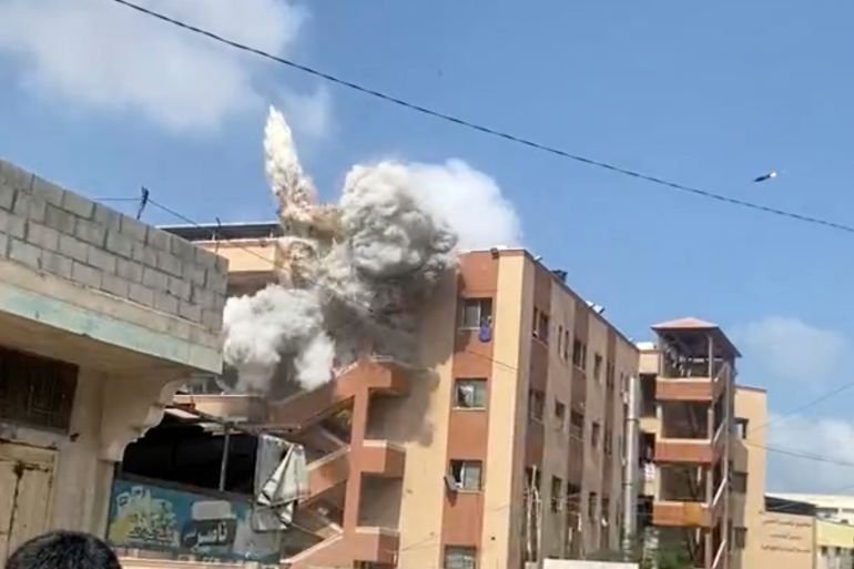 This frame grab from a video shows the second of two projectiles the Israeli army fired in quick succession at a stairwell outside Nasser Hospital, just minutes after an initial round of attacks hit the building in Khan Younis, Gaza Strip, Monday, Aug. 25, 2025. (UGC via AP)