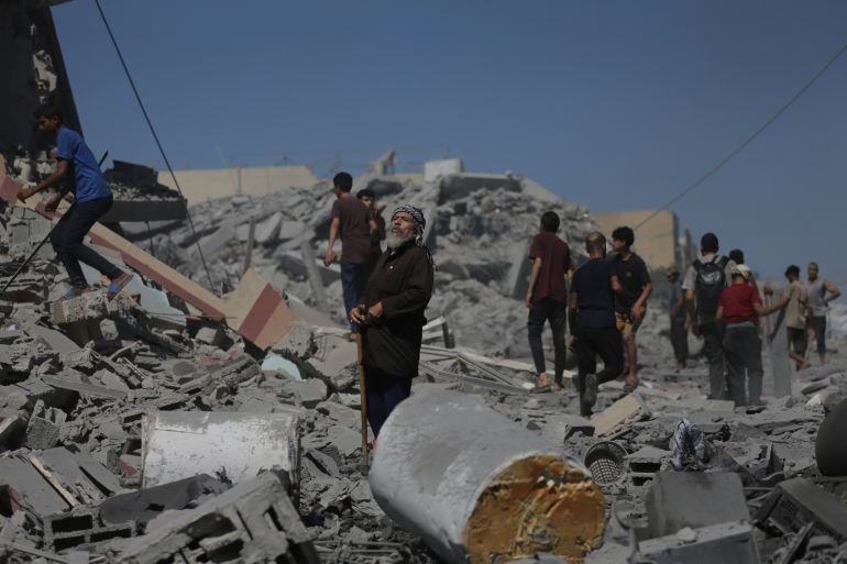 Palestinians inspect the rubble of a building after an Israeli military strike in Gaza City, Friday, Sept. 12, 2025. (AP Photo/Yousef Al Zanoun)