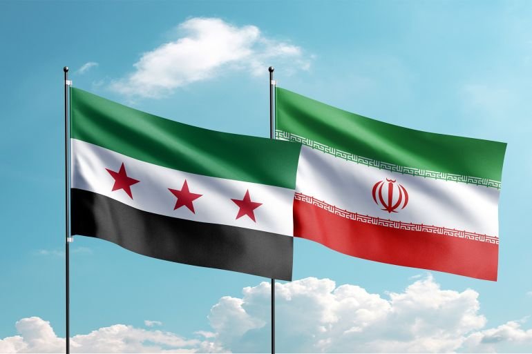 The new Syrian flag and Iran flag are waving in the sky