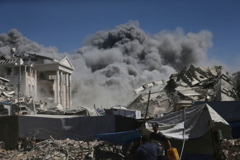 Smoke rises after an Israeli military strike on a building in Gaza City, Saturday, Sept. 13, 2025. (AP Photo/Yousef Al Zanoun)