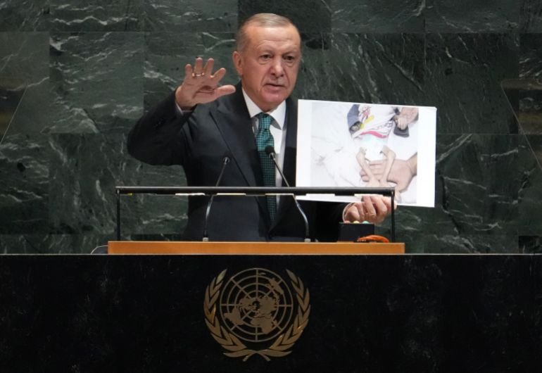 EDITORS NOTE: Graphic content / Turkey's President Recep Tayyip Erdogan holds up a photo from Gaza as he speaks during the General Debate of the United Nations General Assembly at the UN headquarters in New York City on September 23, 2025. (Photo by TIMOTHY A. CLARY / AFP)