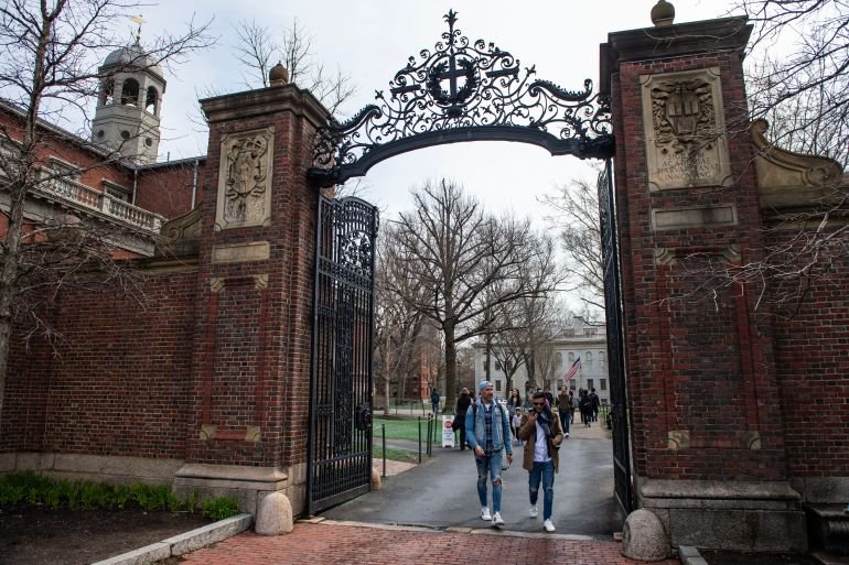 (FILES) People walk through a gate as they exit Harvard Yard on the campus of Harvard University campus in Cambridge, Massachussetts, on April 15, 2025.