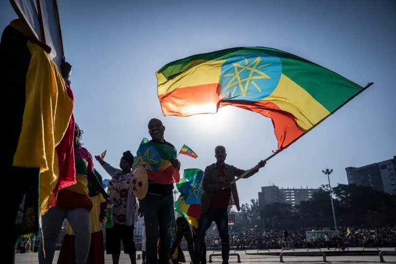 ADDIS ABABA, ETHIOPIA - NOVEMBER 07: People shout slogans as a ceremony is held to support the Ethiopian military troops who is battling against the Tigrays People Liberation Front in Amhara Region on November 7, 2021 in Addis Ababa, Ethiopia. The country's Prime Minister Abiy Ahmed declared a state of emergency on Wednesday as his government's conflict with Tigrayan forces has expanded beyond that group's home region in the north. Tigrayan fighters have recently forged an alliance with the Oromo Liberation Army, a group fighting on behalf of ethnic Oromos, who make up about 35 percent of Ethiopia's 110 million people. (Photo by Getty Images/Getty Images)