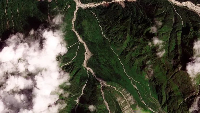 A satellite image shows the valleys near the Nepal-China border on August 25, 2026, before the devastating floods. 2026 PLANET LABS PBC/Handout via REUTERS THIS IMAGE HAS BEEN SUPPLIED BY A THIRD PARTY. MANDATORY CREDIT.