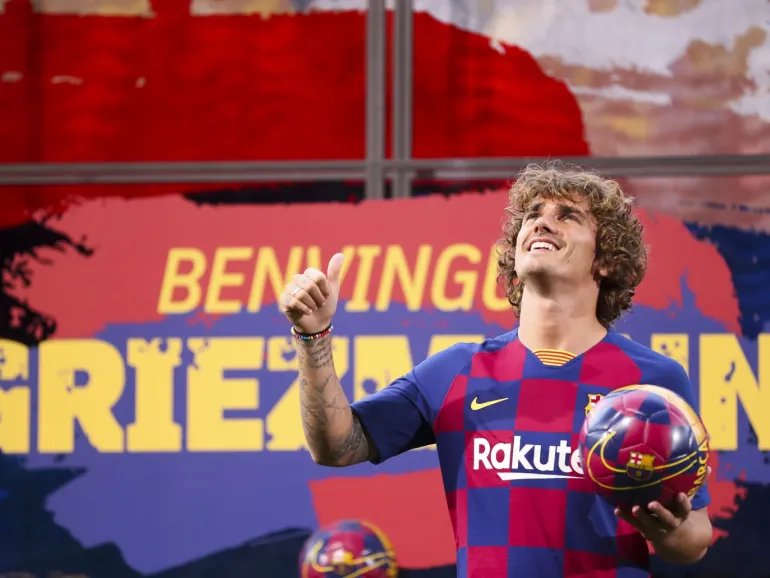 Barcelona sign French star Griezmann- - BARCELONA, SPAIN - JULY 14: Barcelona's new sign French star Antoine Griezmann wearing Barcelona's traditional home jersey poses for a photo during his presentation ceremony at the Camp Nou Stadium in Barcelona, Spain on July 14, 2019.