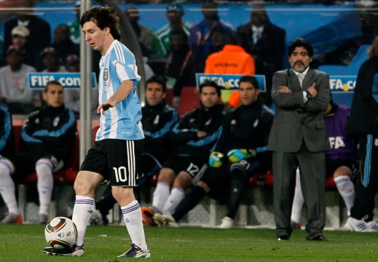 FILE - Argentina head coach Diego Maradona, right, looks at Argentina's Lionel Messi, left, as he controls the ball during the World Cup group B soccer match against Nigeria in Johannesburg, South Africa, Saturday, June 12, 2010. (AP Photo/Ricardo Mazalan, File)