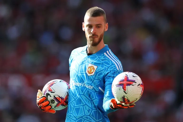 MANCHESTER, ENGLAND - MAY 28: David De Gea of Manchester United holds two match balls during the Premier League match between Manchester United and Fulham FC at Old Trafford on May 28, 2023 in Manchester, England. (Photo by Matt McNulty/Getty Images)