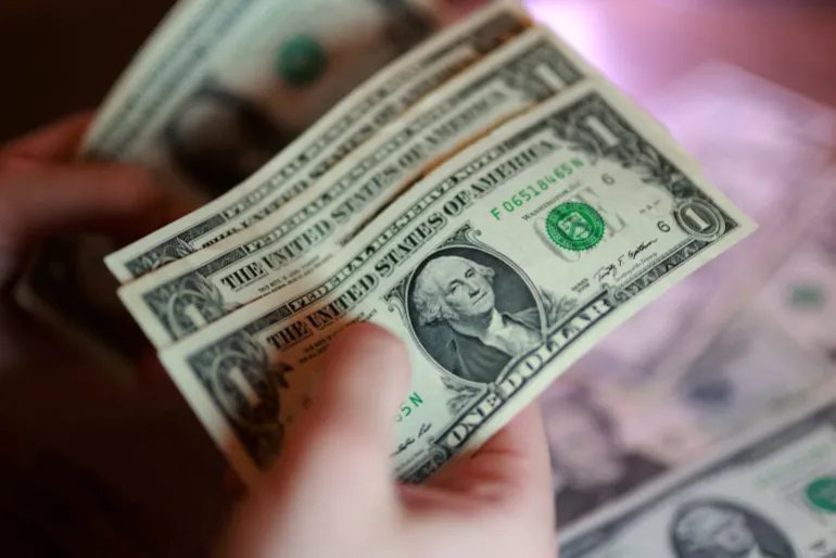 FILE PHOTO: U.S. dollar banknotes are seen in this illustration taken March 24, 2026. REUTERS/Dado Ruvic/Illustration/File Photo
