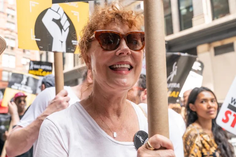NEW YORK, NEW YORK - AUGUST 18: Susan Sarandon joined WGA and SAG-AFTRA members to walk picket lines on a theme Latine Picket as they strike over contract negotiation at Netflix and Warner Bros. Discovery offices in New York on August 18, 2023. The recent polls 74% of American population believes that studios should be forbidden from replacing writers with AI. (Photo by Lev Radin/VIEWpress)