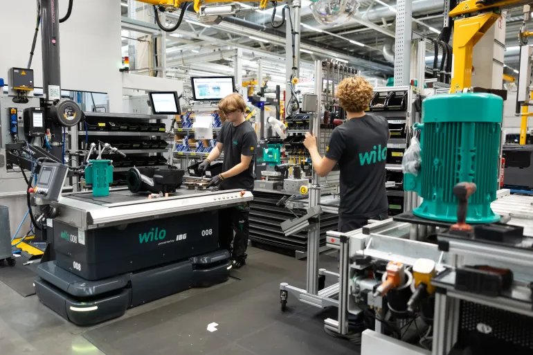 DORTMUND, GERMANY - AUGUST 20: A trainee assembles parts onto a cast pump housing at his work station at Wilo SE, a manufacturer of water pumps, on August 20, 2026 in Dortmund, Germany. The German economy is facing complex challenges in its labor market. On the one hand artificial intelligence has begun displacing workers in certain sectors and many German manufacturers are shedding jobs. On the other hand chronic labor shortages persist in many other sectors. According to a recent report one third of trainees in Germany are dissatisfied with their training program. (Photo by Andreas Rentz/Getty Images)