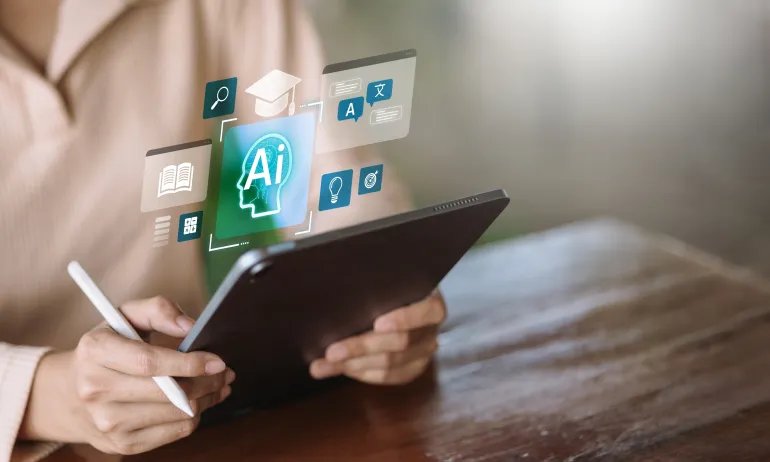 Person using tablet with stylus showing artificial intelligence icons for education, translation, book, and ideas. Concept of AI in learning, smart study, and digital education technology.
