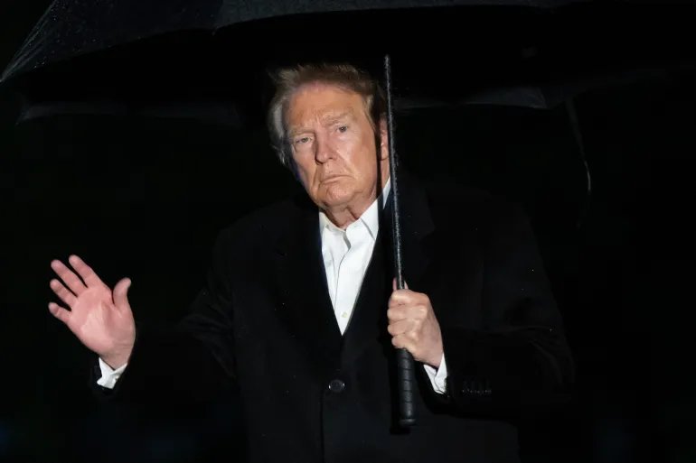 US President Donald Trump waves after stepping off Marine One on the South Lawn upon arrival at the White House in Washington, DC, in the early hours of September 23, 2026.