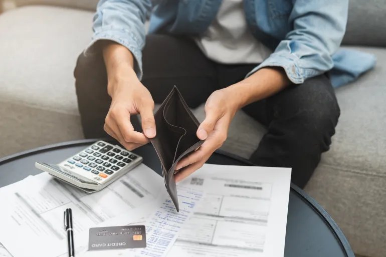 Debt financial concept, stressed problem people asian man, male hand open empty wallet not have budget of money to pay no have credit card, not able payment bill, loan or expense with bank, bankruptcy
