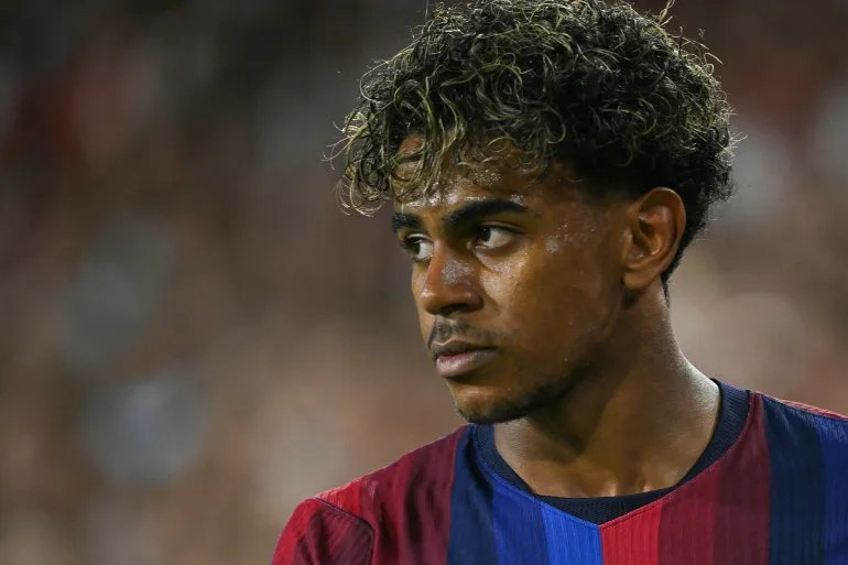 Barcelona's Spanish forward #10 Lamine Yamal looks on during the Spanish league football match between Sevilla FC and FC Barcelona at the Ramon Sanchez Pizjuan stadium in Seville on September 19, 2026.