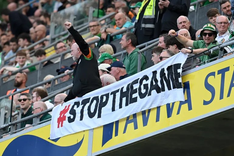 DUBLIN, IRELAND - MAY 28: Fans protest an upcoming match between Republic of Ireland and Israel during the international friendly match between Republic of Ireland and Qatar at Aviva Stadium on May 28, 2026 in Dublin, Ireland. (Photo by Charles McQuillan/Getty Images)