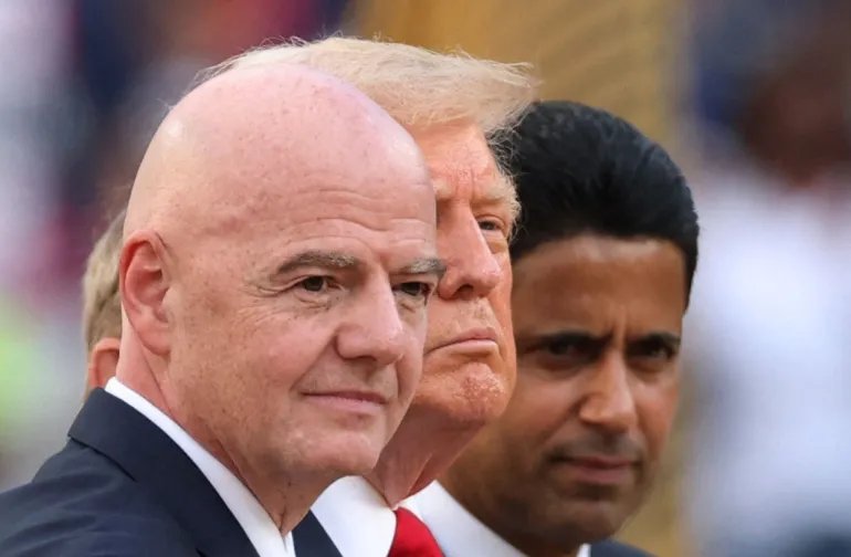 Soccer Football - FIFA Club World Cup - Final - Chelsea v Paris St Germain - MetLife Stadium, East Rutherford, New Jersey, U.S. - July 13, 2025 FIFA president Gianni Infantin, U.S. President Donald Trump and Paris St Germain president Nasser Al-Khelaifi on stage during the trophy presentation IMAGN IMAGES via Reuters/Vincent Carchietta