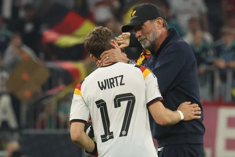Germany's coach Jurgen Klopp congratulates Germany's midfielder #17 Florian Wirtz after the UEFA Nations League Group A2 between Germany and Serbia at the Allianz Arena in Munich, southern Germany on October 1, 2026. (Photo by Karl-Josef HILDENBRAND / AFP)