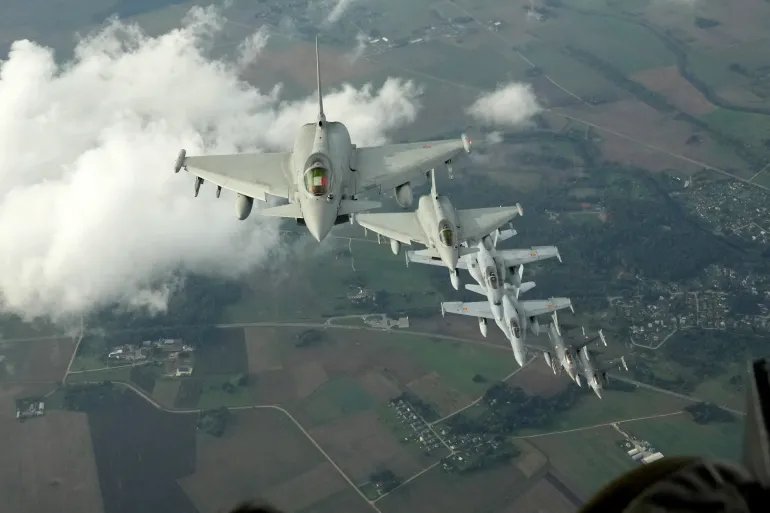 Italian Air Force Eurofighter, Spanish Air Force F-18 and Turkish Air Force F-16 fighter jets fly over Lithuania during a NATO media tour in Siauliai Air Base, Lithuania, September 30, 2026. REUTERS/Ints Kalnins
