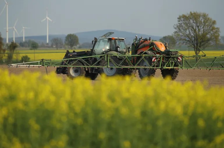 LOEBAU, GERMANY - APRIL 21: A tractor sprays pesticide on a field on April 21, 2018 near Loebau, Germany. The new German government has vowed to tackle the widespread use by farmers of glyphosate, and while a ban is unlikely, German Agriculture Minister Julia Kloeckner recently stated she is seeking measures to discourage the use of the pesticide. Glyphosate has been linked in some past research to cancer. (Photo by Sean Gallup/Getty Images)