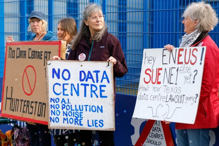 KILMARNOCK, SCOTLAND - SEPTEMBER 30: Community campaigners demonstrating against a proposed large-scale data centre rally outside the Park Hotel, where a B2B event attended by representatives from Eneus Energy is taking place on September 30, 2026 in Kilmarnock, Scotland. Demonstrators from the Reject Hunterston Data Centre Campaign Group and the Hurlford Rufus Data Centre Group are protesting Eneus Energy's proposal to build a large-scale data centre campus in Hunterston, North Ayrshire, raising concerns over the development's potential impact on the local environment and resources. (Photo by Jeff J Mitchell/Getty Images)