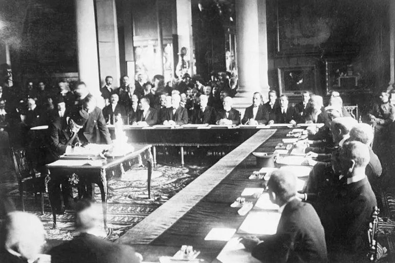 (Original Caption) 8/23/1920-Sevres, France: Signing the Turkish Treaty with the Allies- Photo shows Haki Pacha signing. The inkstand being used is the one ordered by the Kaiser in 1914 for his personal use.