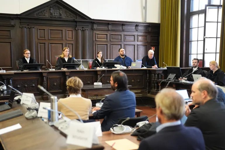 Judge Isabel Hildebrandt (2nd,R), faces defendant, German entrepreneur and gastronome Christina Block and her lawyer Ingo Bott prior to the continuation of the trial over alleged child abduction at the Criminal Court building in Hamburg, northern Germany, on October 5, 2026.