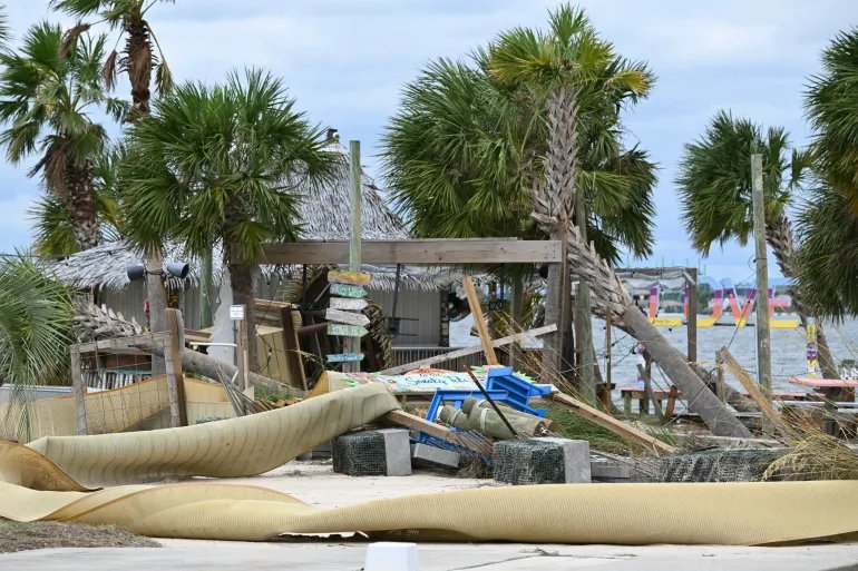 Storm damage to a tiki bar is seen near the shoreline in Pensacola Beach, Florida, on October 10, 2026.