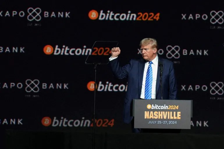 FILE PHOTO: FILE PHOTO: Donald Trump, who was then Republican presidential candidate, gestures at the Bitcoin 2024 event in Nashville, Tennessee, U.S., July 27, 2024. REUTERS/Kevin Wurm/File Photo/File Photo